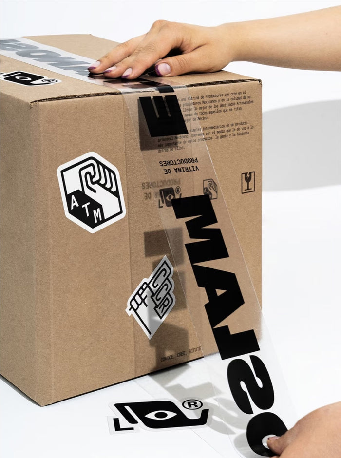 Clear custom printed packing tape with black logo applied to a carton