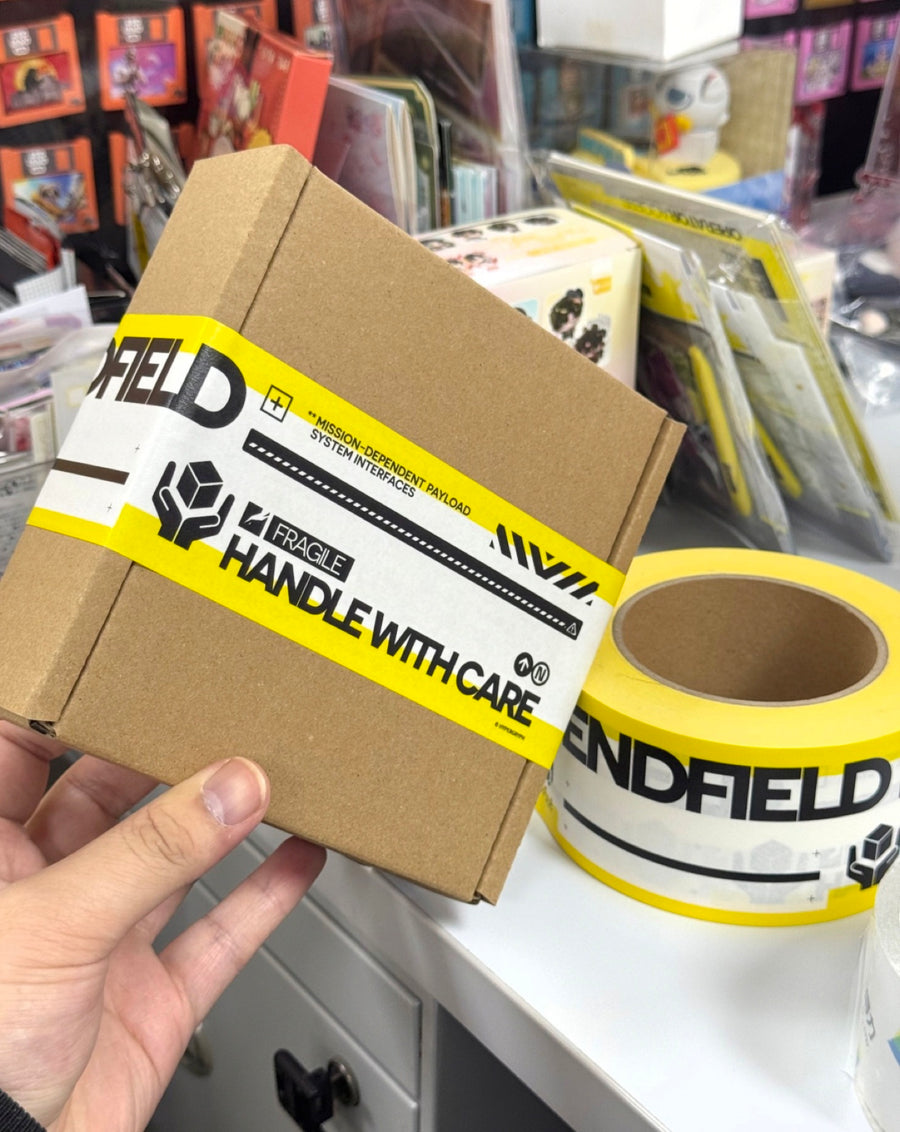 Real custom logo tape applied to a small shipping carton