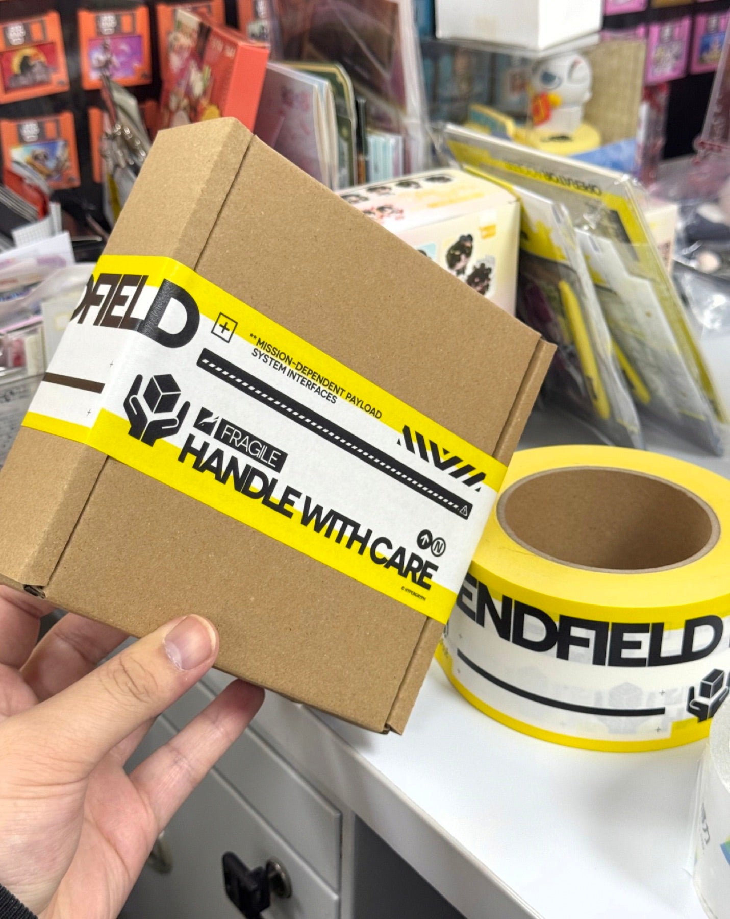 Real custom logo tape applied to a small shipping carton